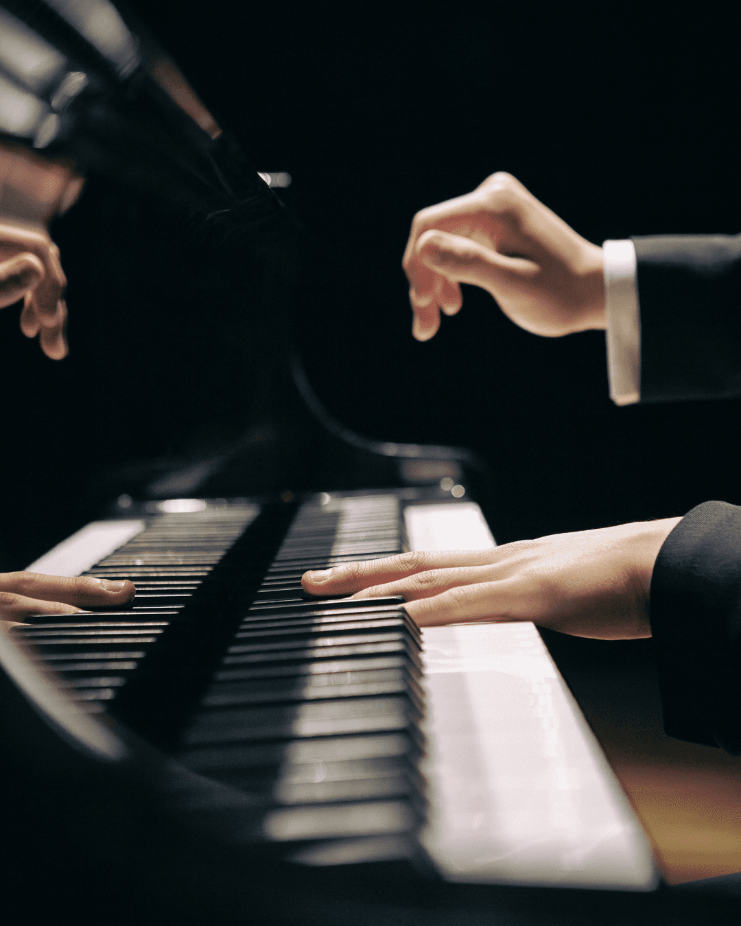 Hands playing piano